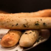Garlic Breadsticks · Warm breadsticks, garlic butter, Romano cheese, marinara, and ranch or giardiniera ranch.