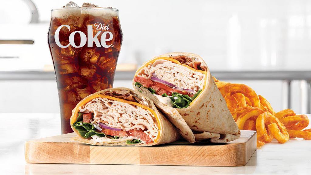 Roast Turkey Ranch & Bacon Wrap · Sliced roast turkey breast with bacon, cheddar cheese, green leaf lettuce, tomato, red onion and parmesan peppercorn ranch sauce in an artisan wheat wrap. Visit arbys.com for nutritional and allergen information.