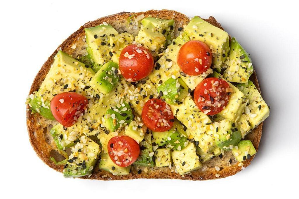 Everything Avocado Toast · Avocado and Tomato sprinkled with a blend of everything seasoning (think Everything Bagel) on a thick slice of sourdough toast.. Avocado, Cherry Tomatoes, Everything Seasoning, Pink Himalayan Salt, Black Pepper