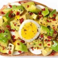 Avocado & Egg Toast · Our signature sourdough toast is the base layer for creamy avocado, tender hard-boiled egg, ...