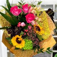 Hand-Tied Bouquet · A fresh bouquet of a variety of seasonal flowers and textures.  Upgrade to Deluxe or Premium...