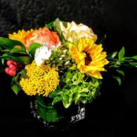 Carmichael · 4x4 cube or cylinder of brightly colored flowers in oranges and yellows in a pavé design (lo...