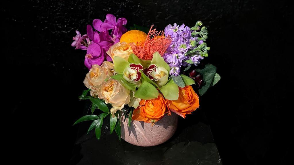 Candy Heart · With so many vibrant colors this pavé arrangement is as sweet as candy. Bright orange, pink and purple materials like roses, orchids, and citrus fruit make a visually tantalizing gift. Designed in a 5x5