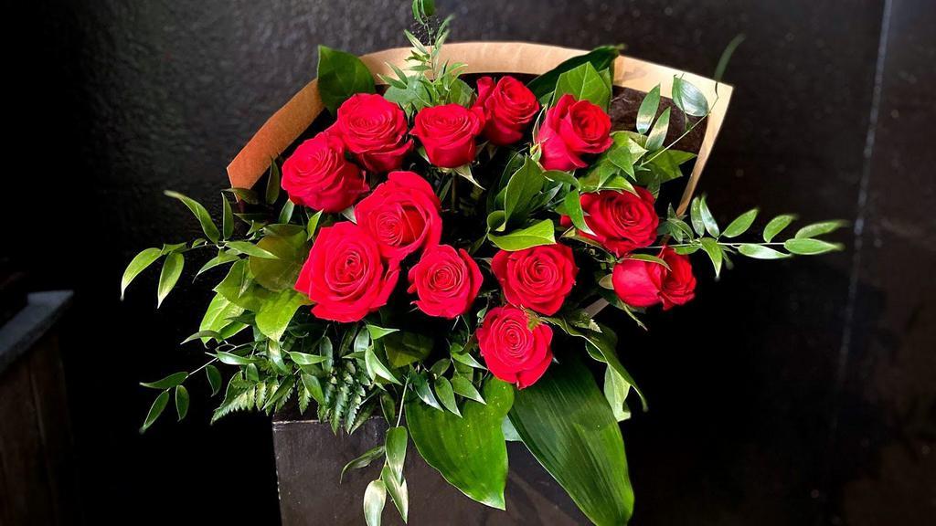 Dozen Roses - Wrapped · 12 red roses wrapped with a mix of premium greenery. **Sold out of eco-fresh stem wrap. ***

Other color options are available and should be confirmed prior to ordering.