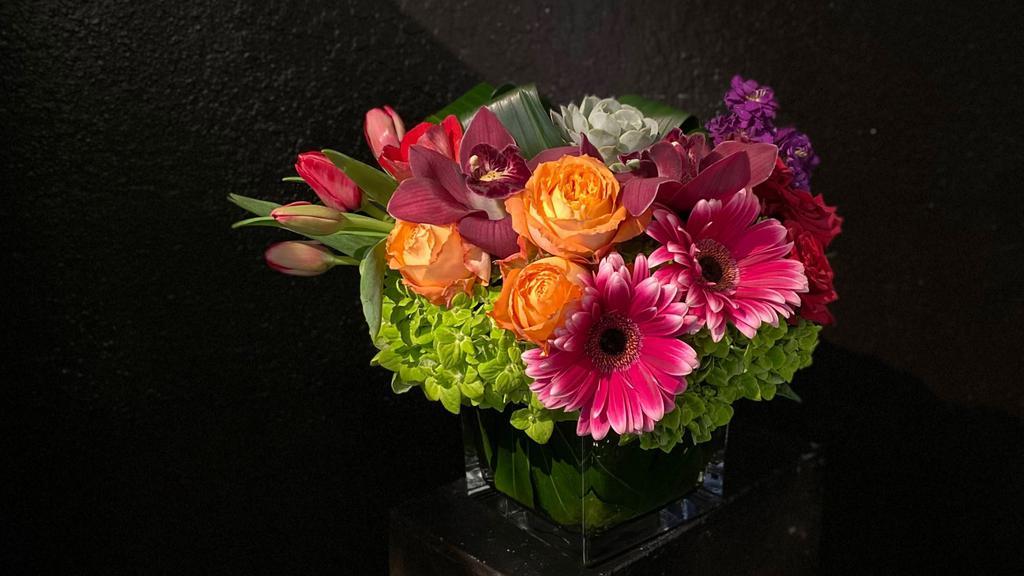 Jewel Tones · One of our larger pavé styled arrangements makes a big impact with its variety of bright jewel-toned flowers and textures. Materials like roses, tulips, orchids, succulents, and more are designed in a large 6x6