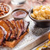 Texas Beef Brisket Platter · Our classic Texas Beef Brisket is rubbed with a blend of Dave's secret spices, coarse black ...