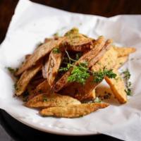 Potato Wedges · Fresh cut potato wedges fried to a golden brown crisp. Served with ranch.