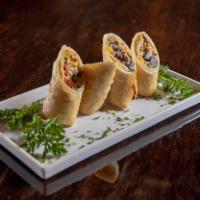 Southwest Rolls · Smoked chicken, black beans, corn, jalapeno jack cheese, red peppers & spinach wrapped in a ...