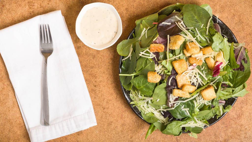 Caesar Salad · Chopped romaine, croutons, parmesan tossed in a creamy caesar dressing.