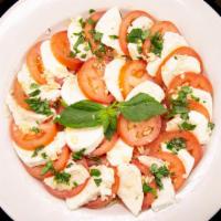 Caprese Salad · Fresh mozzarella, tomatoes, basil topped with balsamic glaze.