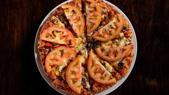 Vegetarian · Our traditional sauce & mozzarella cheese w/ mushrooms, bell pepper, onions, olives, artichoke hearts & fresh tomatoes.
