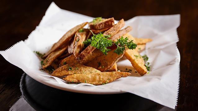 Chicken & Wedges · Cut fresh daily bone-in chicken fried to a golden brown crisp served with potato wedges.