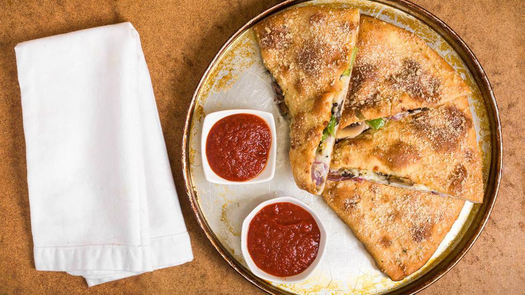 Specialty Calzone · Stuffed & baked w/ your favorite pizza toppings. Served with side of fresh made marinara sauce.