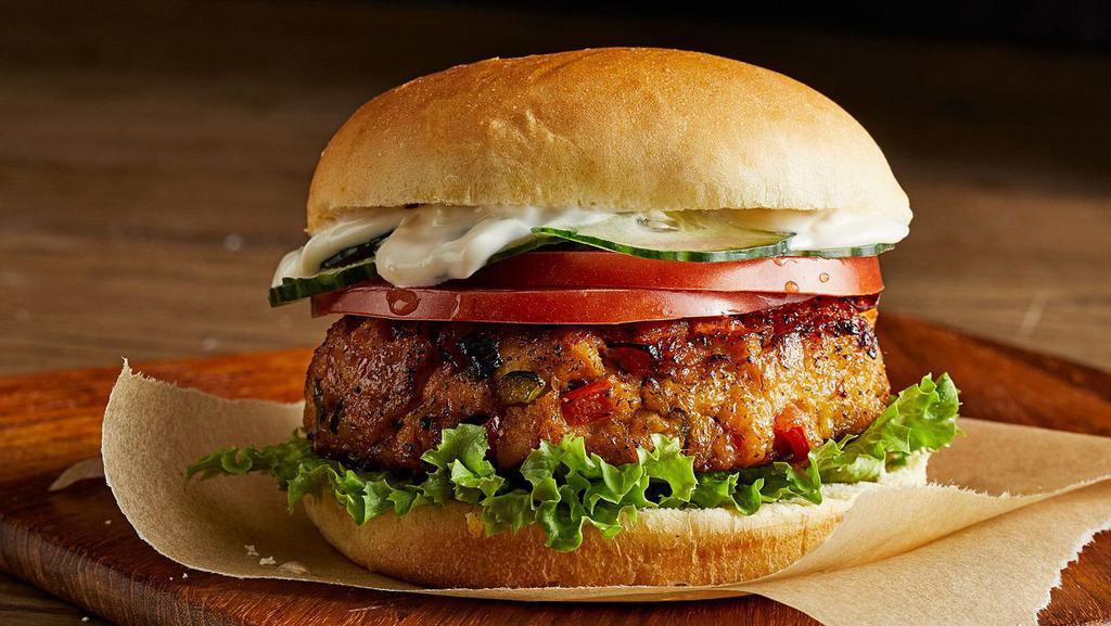 Salmon Burger & Tots Box · Sustainable Pan Seared Alaskan Wild Salmon, Blackened Seasoning, Lettuce, Tomato, Tartar Sauce. Served with Tater Tots