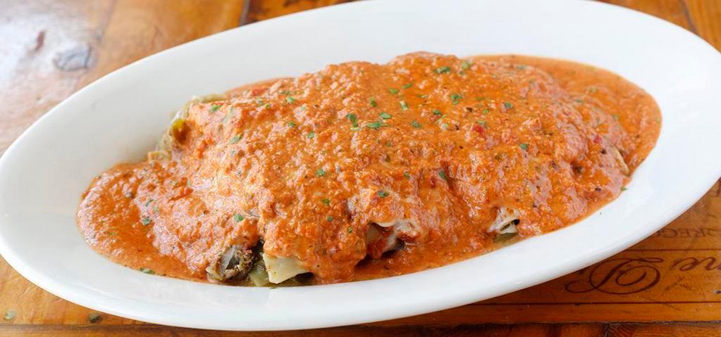 Sausage Lasagna · Spicy. Roasted Italian turkey sausage layered with mushrooms,  onions and bell peppers, topped with a choice of garlic cream, marinara, or pink sauce.