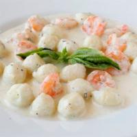 Artichoke Shrimp Gnocchi · Ravioli stuffed with artichoke paté tossed in with shrimp in chardonnay lemon sage cream.