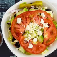 Greek Salad · Lettuce, tomatoes, Kalamata olives, fetta cheese, cucumber and red onions.