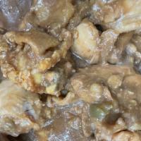 Smothered Chicken · Three fried chicken thighs smothered light savory gravy served over white rice. Two sides, c...