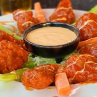 Tampico Wings · 8 Breaded Chicken Wings tossed in our Special Sauce. Served with Carrots, Celery, & Ranch.