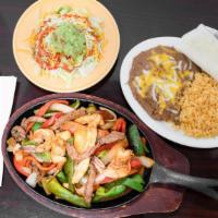 Fajitas · Served with rice, beans, salad and tortillas.