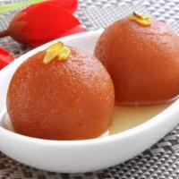 Gulab Jamun · A classic Indian dessert made of milk balls in sweet light warm syrup.