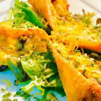 Tex Mex Egg Rolls · Freshly stuffed chicken egg rolls with shredded cheese, black beans, red onions, bell pepper...
