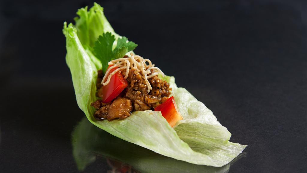 Lettuce Wrap · Ground chicken spiced with house sauce, shitake mushroom, water chestnuts and onion served with iceberg lettuce and crispy noodles.