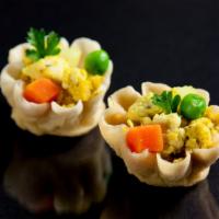 Curry Cup · Crispy mini cups filled with spiced minced chicken, potato, onion, carrot, peas and a cucumb...
