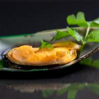 Herb Mussel · Steamed New Zealand mussels with lemongrass, basil, lime leaves and lime garlic sauce.