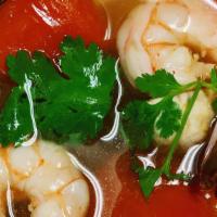 Tom Yum · Mild spicy and sour soup with shrimp, mushroom, tomato, lemongrass, lime leaves.