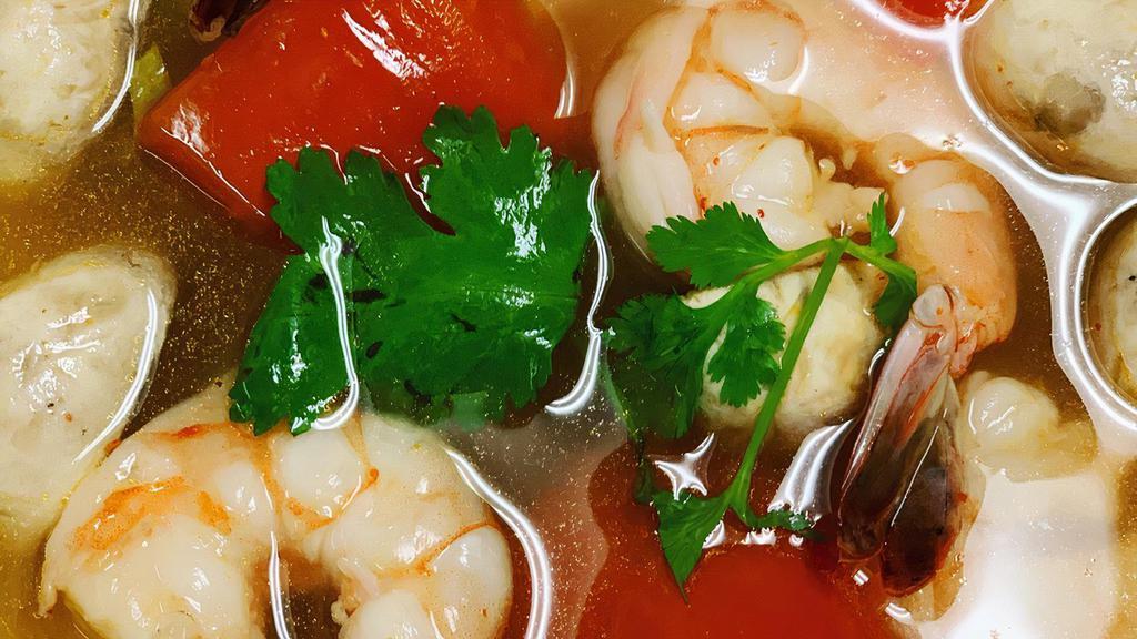 Tom Yum · Mild spicy and sour soup with shrimp, mushroom, tomato, lemongrass, lime leaves.
