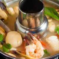 Andaman Sea · Shrimp, squid, mussel, scallop, mushroom, tomato in a spicy sour soup spiced with Thai herbs...