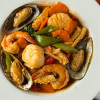 Spicilicious Seafood · Prawn, squid, mussel, scallop stir-fried with bell pepper, carrot, onion and basil in our sp...