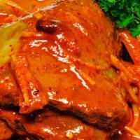 Lamb Shank  · Braised Australian lamb shank in classic Thail Massaman curry with carrot, onion, peanut and...