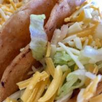 Two Crispy Tacos · Shredded beef or chicken filled with lettuce and cheese.