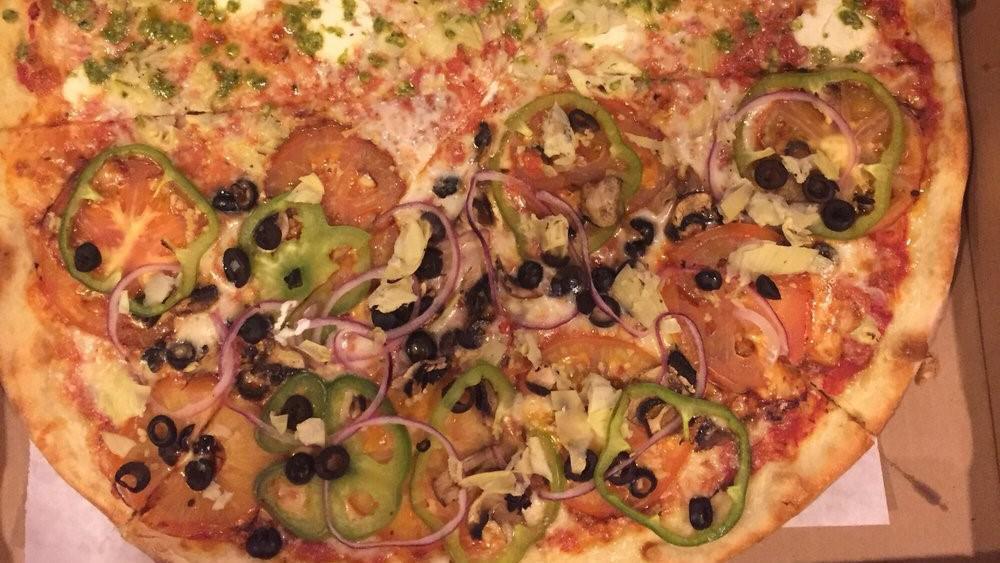 Vegetarian · Mozzarella cheese, tomatoes, onions, green bell pepper, garlic, mushrooms, black olives, infused olive oil.