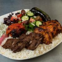 Beef Steak & Chicken Leg Meat Kabob Plate · All plates come with your choice of three sides, pita bread, and roasted tomato or jalapeno.