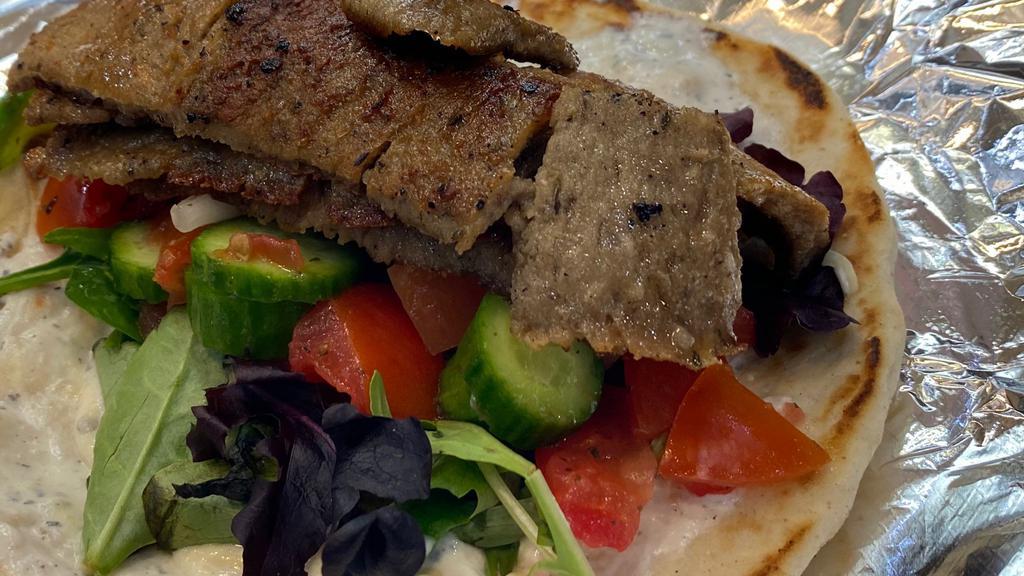 Gyros Wrap · Gyros, tomato, lettuce and choice of onion, tzatziki sauce. Served with salad or fries.