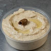 Mutabbal · Baba ganoush. Grilled eggplant, fresh garlic, and tahini blended together, topped with olive...