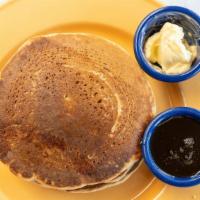 Vegan Multigrain Pancakes · 3 multigrain pancakes, with your choice or banana or chocolate chips inside, served with 100...