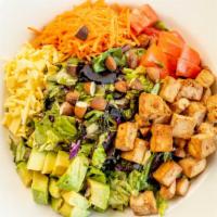 Vegan Cobb Salad · Sauteed tofu, avocado, vegan cheese, chopped almonds, shredded carrots and tomatoes, served ...
