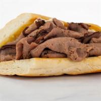 Prime Rib French Dip · Slow-roasted prime rib piled on a baguette spread with creamy horseradish aioli and served w...