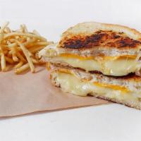 Mega Grilled Cheese · Jack, Cheddar, Swiss, and American on our sourdough. bread grilled with Ms. Polly’s special ...