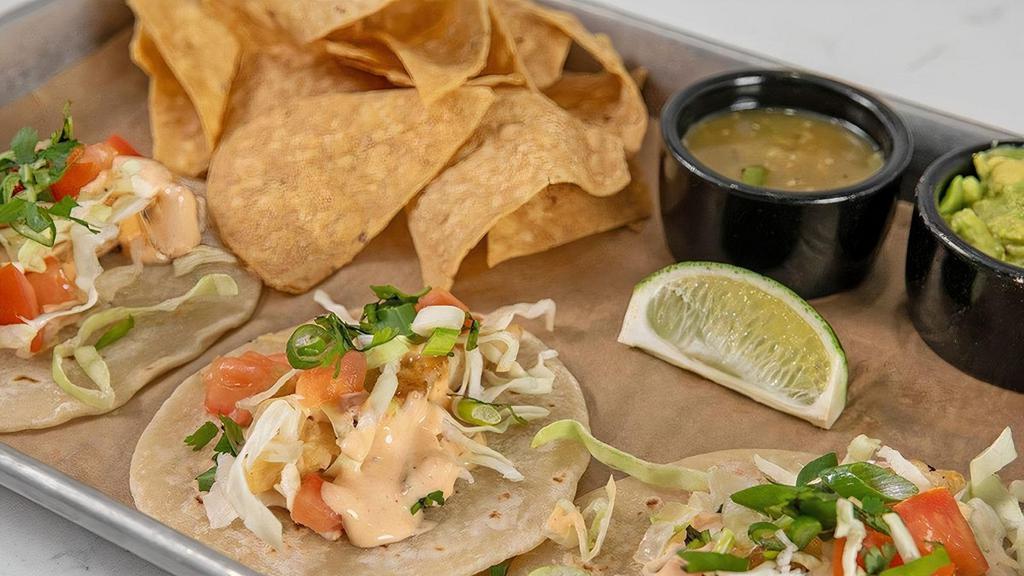 Fish Tacos · Choose beer-battered fried or grilled cod, shredded. cabbage, tomato, cilantro, green onion, and Ms. Polly’s. Spicy Dressing.