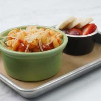 Jr Pasta With Red Sauce · Cavatappi pasta with red sauce topped with parmesan cheese. Includes choice of one Jr. side.