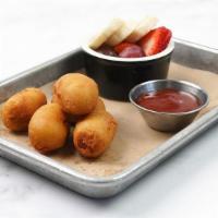 Mini Corn Dogs · The perfect finger food! Served with ketchup for dipping. Includes choice of one Jr. side.