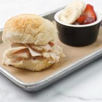 Jr Turkey Sandwich · Roasted turkey & cheddar on our freshly baked roll spread with mayo. Includes choice of one ...