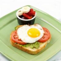 Avocado Toast W/ Egg · Our freshly baked toasted sourdough bread with. smashed avocado, sliced tomato, an egg, and ...