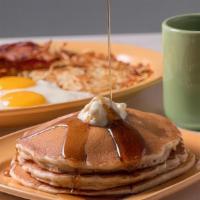 Polly'S Triple Breakfast Surprise · Three sweet buttermilk pancakes served with. butter, syrup, three large eggs, a choice of th...