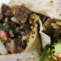 Carne Asada Burrito · Premium steak, locally grown veggies, Spanish rice, and hearty beans folded into a warm flou...